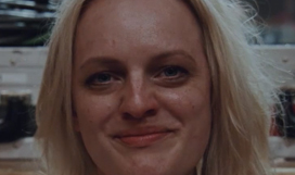 Image of Elizabeth Moss smiling.