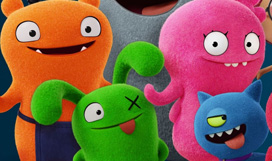 An image of all the UglyDolls standing together smiling