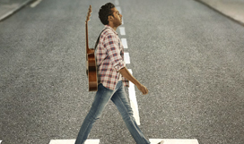 Himesh Patel walking across Abbey Road